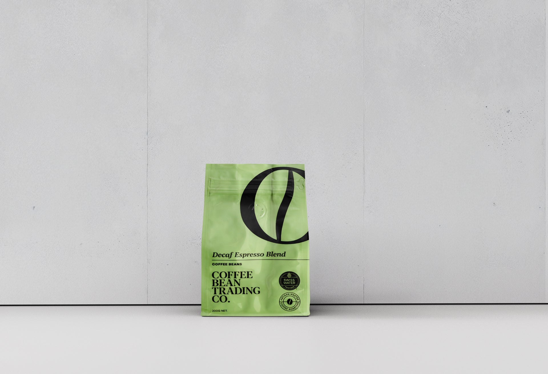 Green coffee bean packaging with a logo on a white background